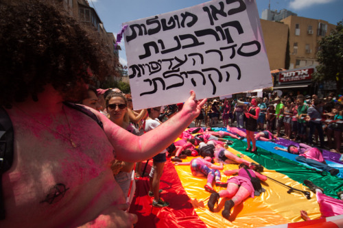 chubbygurl:  occupiedmuslim:  bidyke:  Today, on the Tel Aviv Pride Parade, our queer-anarchist activist group, Mashpritzot, protested against pinkwashing and the “gay” community’s priorities. The group painted themselves pink in protest against