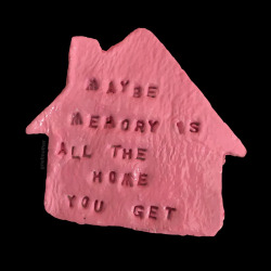 liebelesbe:heavensghost:ceramic home with a quote from John Murillo [ID: A simple pink house with the words: “maybe memory is all the home you get” on it.] 