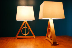 wickedclothes:  Harry Potter Deathly Hallows Table Lamp Crafted out of beautiful cherry wood, this Deathly Hallows table lamp is a lovely accent to any room. The inner circle spins freely. This lamp is 24” tall. Sold on Etsy.