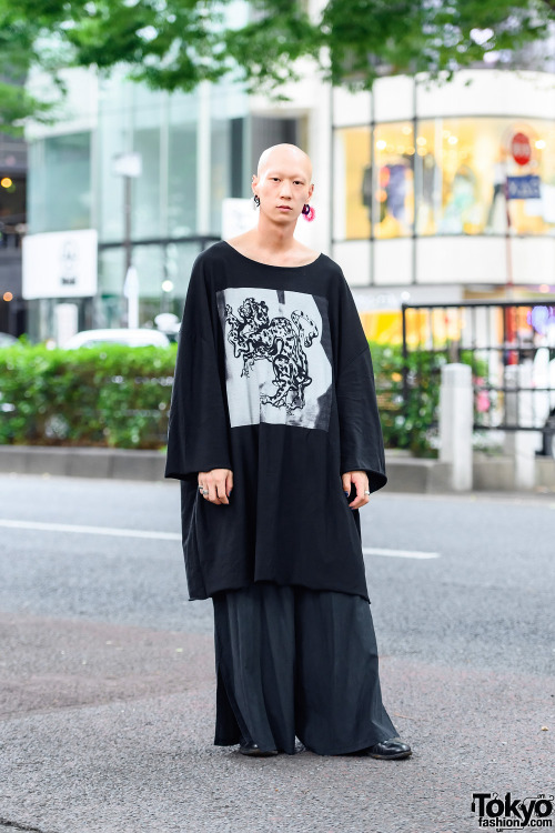 Japanese drummer/model Shouta on the street in Harajuku wearing an oversized look with a graphic shi