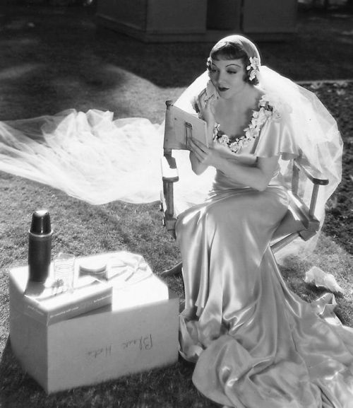 “Claudette Colbert touching up her makeup on the set of It Happened One Night, 1934 ”