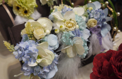 sky blue hydrangeas and white feathers, perfect for wedding photo-shoots!