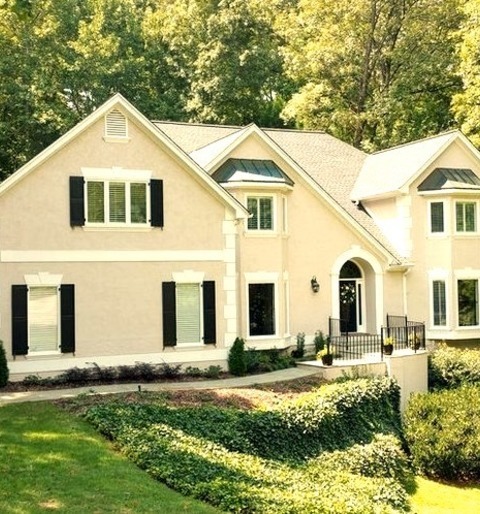 Atlanta Transitional ExteriorLarge Transitional Beige Two-story Stucco House Exterior Idea With A Hip