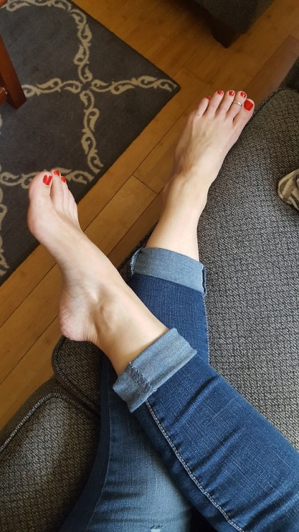 My pretty wifes sexy arch and gorgeous toes on the couch.please comment