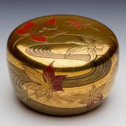 treasures-and-beauty:   Harui Kōmin 春井恒眠  - Tea Caddy with Maple Leaves over the Tatsuta River (1912 - 1926)  Japan. Wood, laquer, gold.