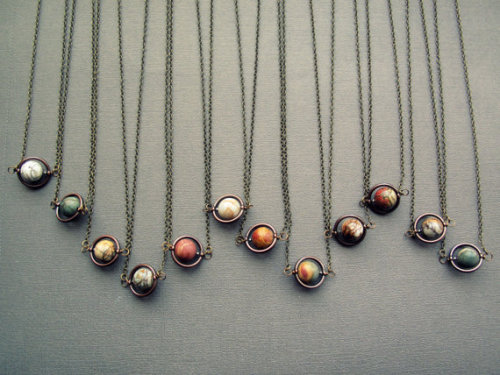 wickedclothes:Planet NecklacesThese planetary necklaces aren’t just of our own solar system bu