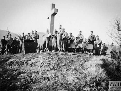 Chaplain Paul J. Maddox conducting Easter sunrise services for men of IV Corps. In front is Major Ge