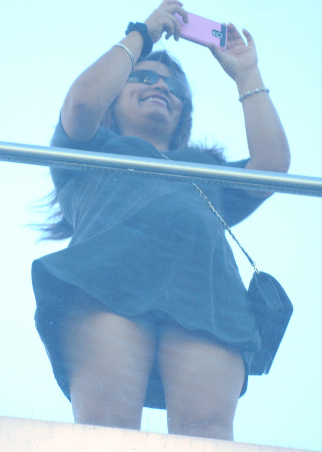 So as I go under the ped bridge in front of the Cosmo I see her taking a picture,