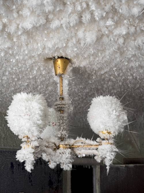 redlipstickresurrected: Maria Passer/Anadolu Agency/ - Vorkuta, Komi Republic, Russia   -   An inside view from snow and ice covered abandoned building in Severny region in Komi Republic. The extremely cold climate in Vorkuta, where temperatures can be