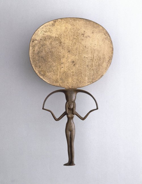 ancientart:  Mirrors of the ancient world.  These mirrors would have once been highly polished in order to provide a good reflection. The 1st shown is Classical Greek (ca. 460 BC): Caryatid Mirror with Aphrodite. The central female figure serves as the