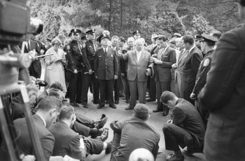 Nikita Krushchev (centre) is interviewed by newsmen on the roadoutside Killenworth in Glen Cove, New