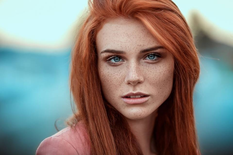 Girl with red hair freckles green eyes