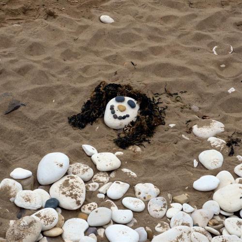 Smiling face on the beach.