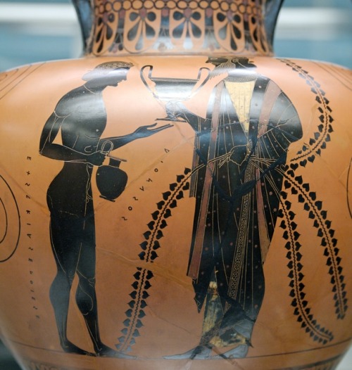 Dionysus, holding a kantharos, with his son Oenopion.  Detail from an Attic black-figure amphor