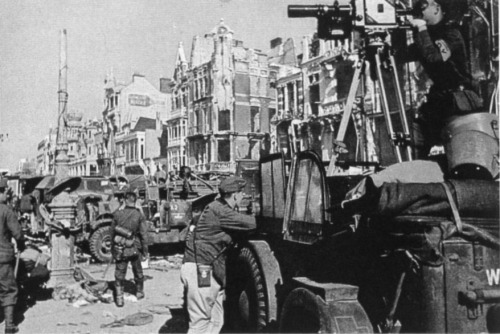 ww2inpictures:A German army camera crew films the destruction left behind by the British withdrawal 