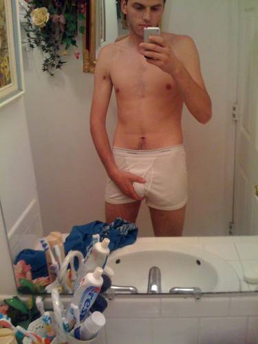 undie-fan-99:  Guy showing off in (what appears to be) his white Hanes boxerbriefs.