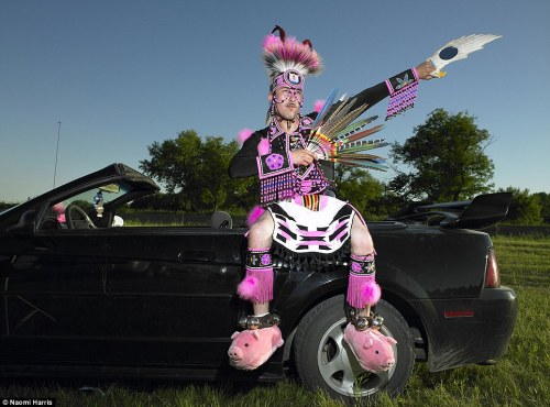A Sioux Indian in an unusual attire complete with pink pig-shaped slippers attends a Valley Pow Wow 