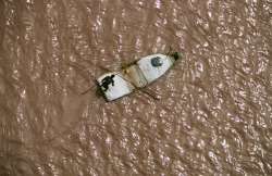 unrar:    Boat piled high with salt deposits,