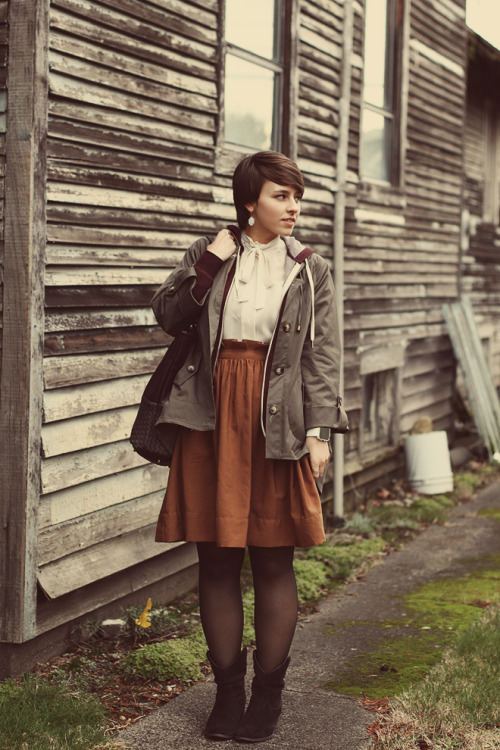 Bronze colored skirt with grey coat and black sheer pantyhose