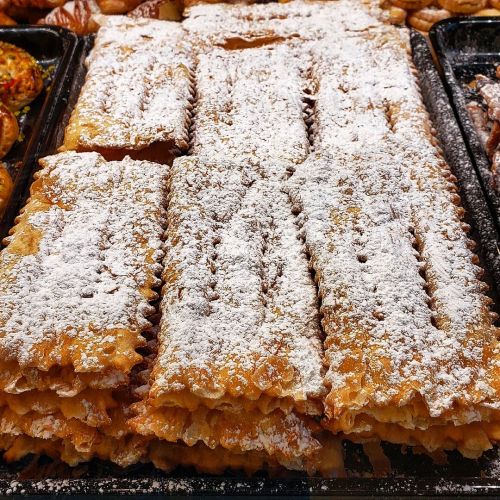 Chiacchiere di Carnevale, pictured, are a crunchy, sweet, fried dough garnished with powdered sugar.