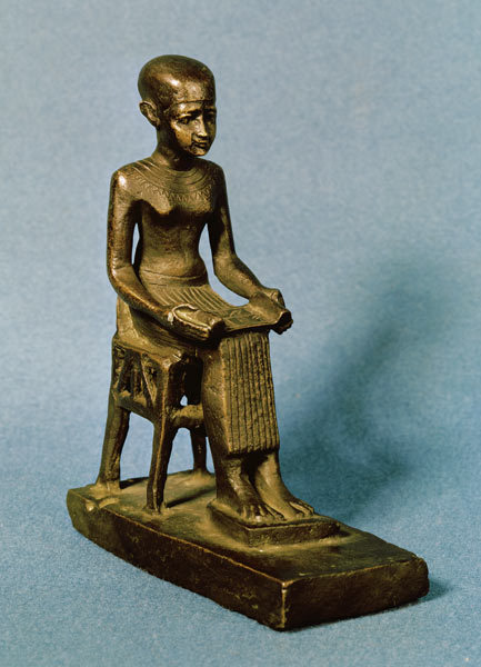 Seated statue of Imhotepfl.c. 2650–2600 BC holding an open papyrus scroll (bronze). Architect and vi