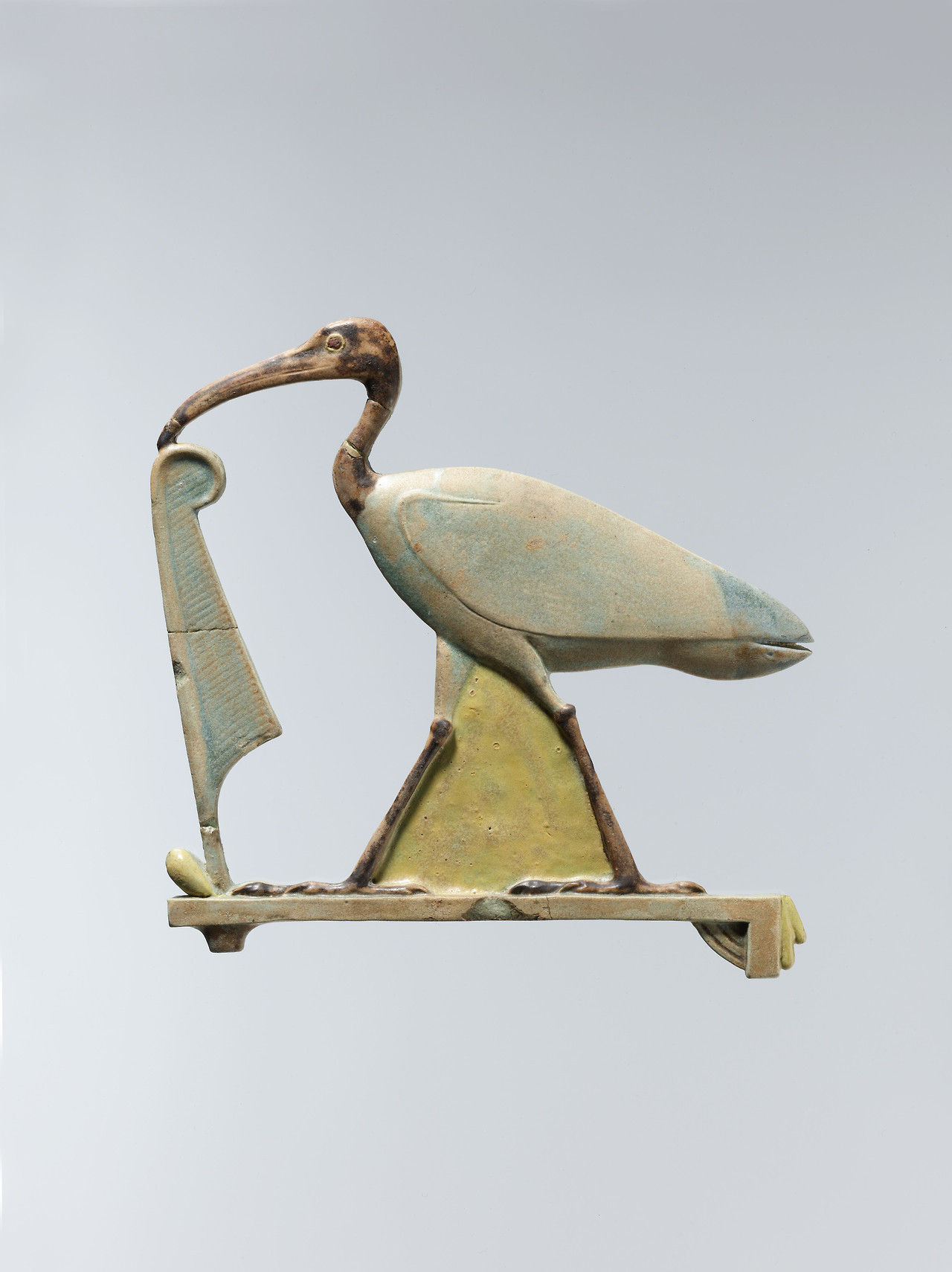 theancientwayoflife:~ Inlay depicting Thoth as the ibis with a maat feather. Period: