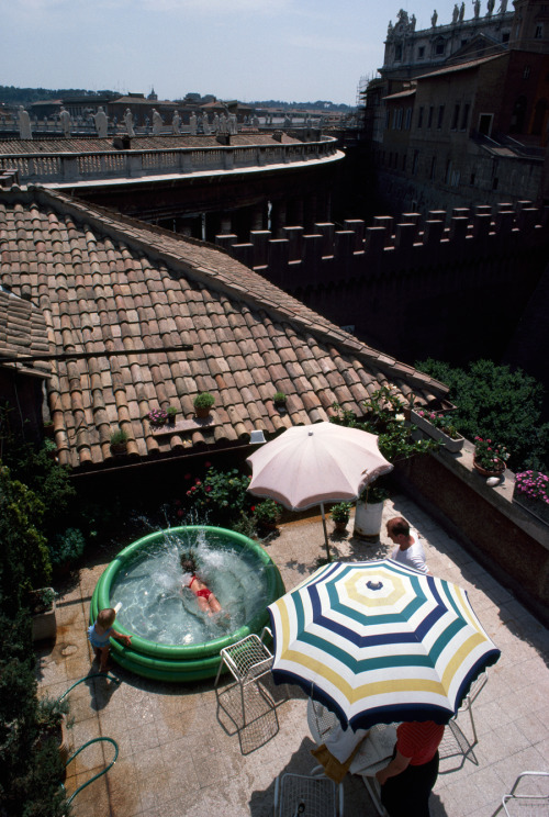 A married Swiss Guard and his family enjoy a patio pool at their compound in Vatican City, 1985.Phot