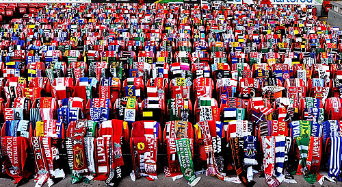 kemlyn:  Scarves donated by football fans from around the world hang on 96 empty