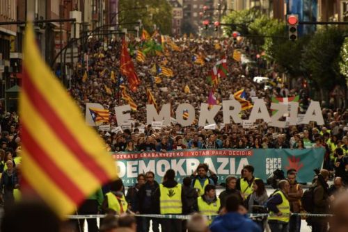 Pro independence supporters wave “estelada” or pro independence flags during a rally in 