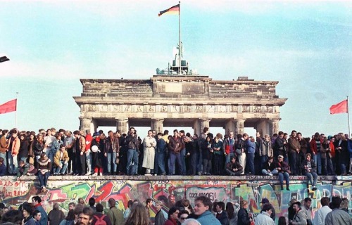 West Berlin citizens holding a vigil on top of the Brandenburg Gate (November 10th, 1989).  This was