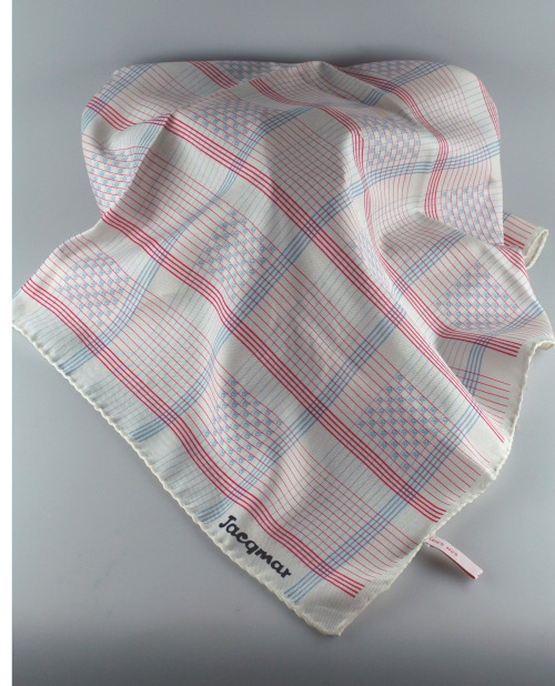 Polyester twill Jacqmar scarf with machine rolled edges. White ground with a linear check motif in p