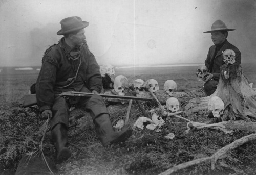 S. Hall Young with another man looking at Yupik Eskimo skulls, Alaska, ca. 1903