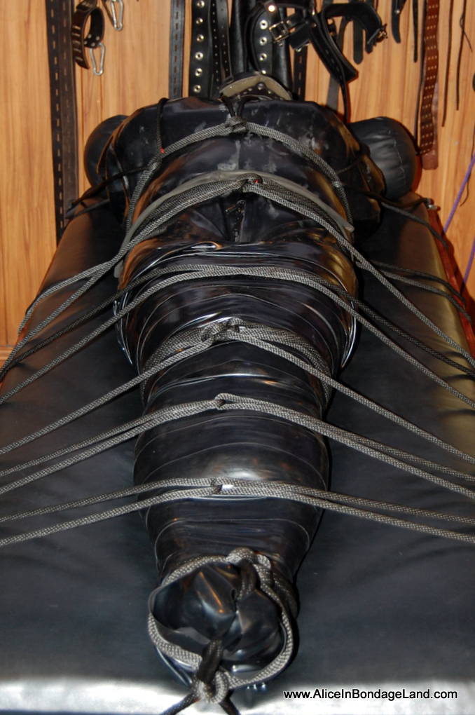 Heavy rubber mummification with rope bondage plus sensory deprivation with tease