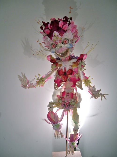 deermary:  Cedric Laquieze’s art pieces using flowers on articulated skeletons 