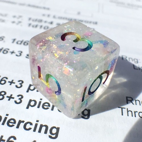 battlecrazed-axe-mage: Surpriiiiiise–I made ‘em rainbow!  These are Cozy Gamer’s Celestial dice with