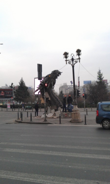 just-another-leaf-in-the-wind:beguilingblackness:Smaug The Sculpted, from Unirii (Union) Square in B