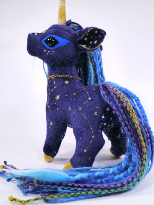 A celestial Unicorn I made is now up for adoption!  :D  I love the hand-painted stars on t