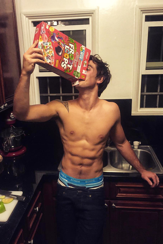 KJ Apa would like to remind you that a good breakfast is important, but plateware and milk are optional.