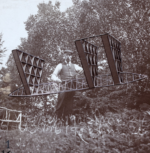 An Alexander Graham Bell associate holds a multicelled kite, 1903.No Credit Given