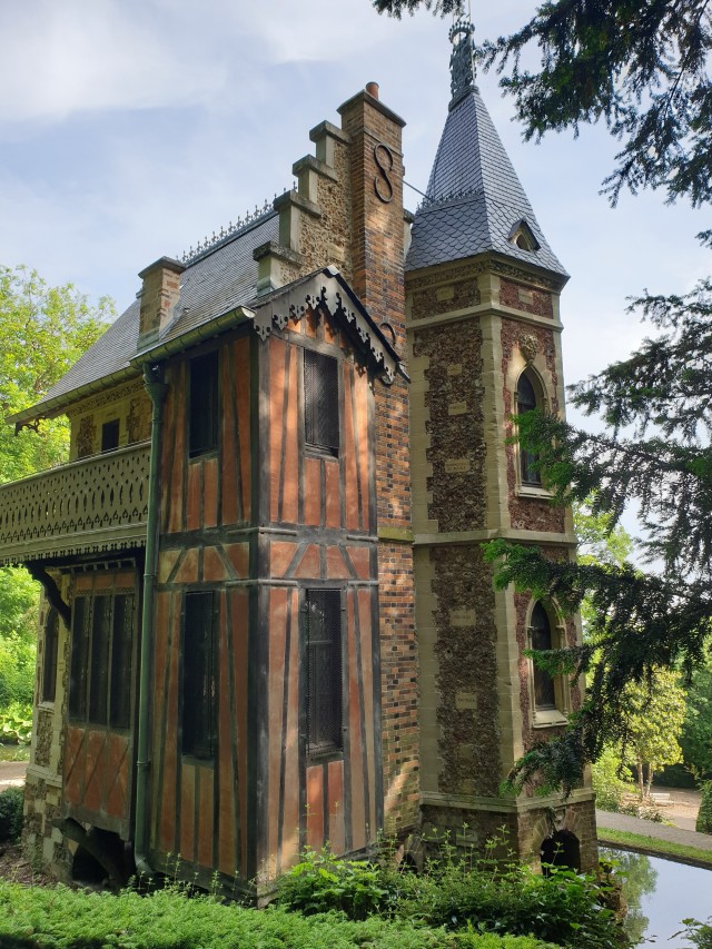 a view from the back of the castle, red stone in a more farmhouse style with black beams