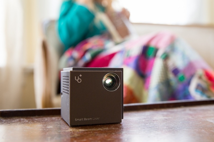 photojojo:  You can find TONS of portable projectors online, but most have lackluster