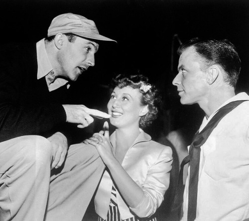 mostlydaydreaming:Gene Kelly talking to Frank Sinatra on the set of “On the Town” with Betty Garrett