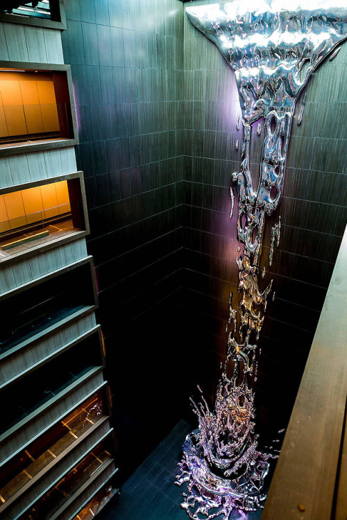 itscolossal:A Multi-Story Metallic Splash by Pere Gifré Drops Through the Center of a Madrid Hotel