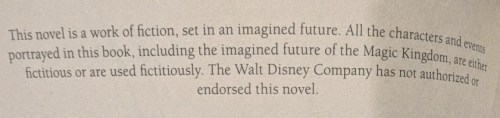 A photograph of the copyright page from my novel *Down and Out in the Magic Kingdom*, reading 'This novel is a work of fiction, set in an imagined future. All the characters and events portrayed in this book, including the imagined future of the Magic Kingdom, are either fictitious or are used fictitiously. The Walt Disney Company has not authorized or endorsed this novel.'