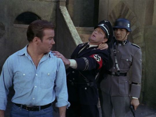 coffiend-jackalope:  imagine-jim-bones-and-spock:  In light of recent events, here is a picture of Spock nerve pinching the SHIT out of some nazi scum.    There is more to this than ‘Spock takes out a Nazi’. Shatner and Nimoy are Jewish. They specifically