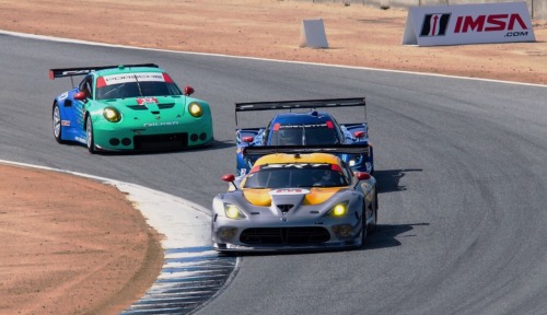 The 2014 IMSA Monterey Grand Prix with the N° 93 Dodge SRT Viper GTS-R leading a line of competitors