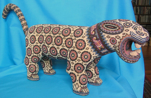 libutron:Huichol Beaded Jaguar This wooden jaguar was made by a Huichol artist that lives in Jalisco