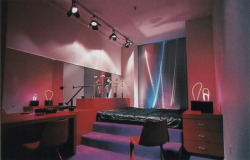 80sdeco: Track lighting, freestanding neon art, reflective mini blinds, purple carpeted step platform bed palmandlaser From “The International Collection of Interior Design” (1985) 