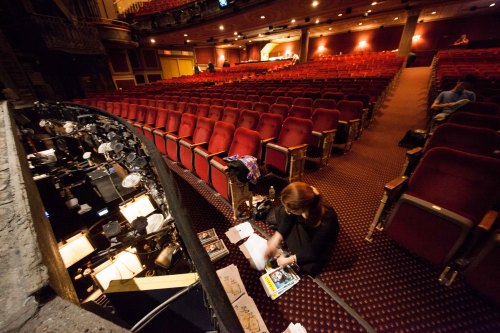 One of our ushers stuffing playbills pre-performance. Photo by maxgordonphotography.