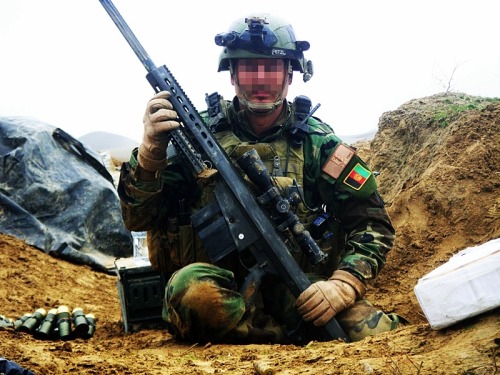 ltclaws:  boss-of-the-plains:  gunrunnerhell:  Still works… Scout sniper codename “Cool Breeze”, a member of the Marine Special Operations Team (MSOT) with his Barrett M107 SASR that sustained a direct hit in the magazine well from a PKM’s 7.62x54R